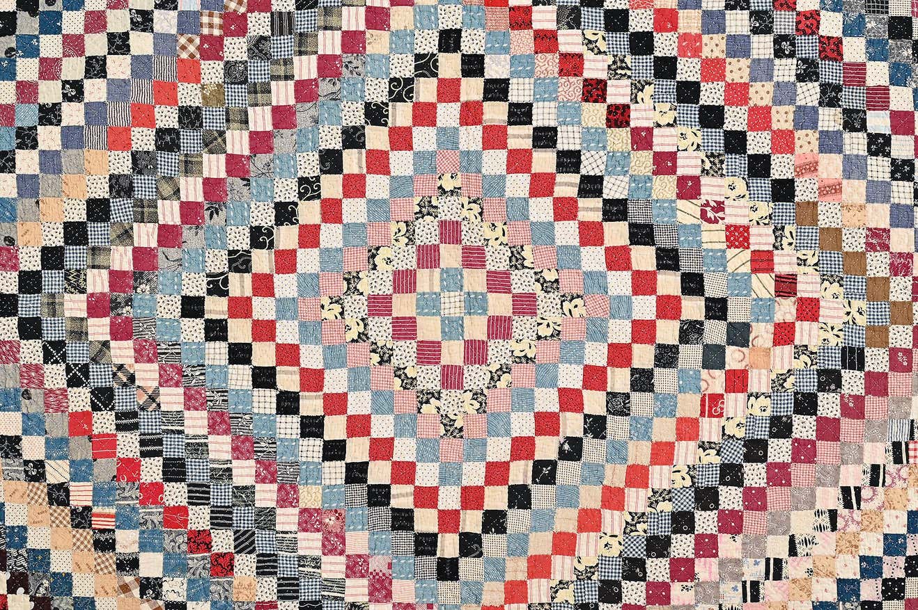 Close up view of diamond in square patchwork on antique quilt #1451832.