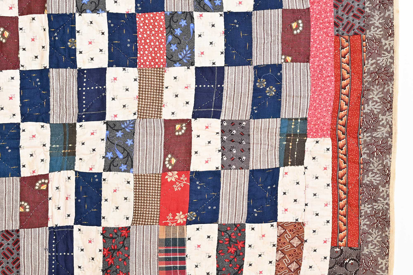 Stitching and patch close up of 19th century Calico One Patch Rectangles Quilt.