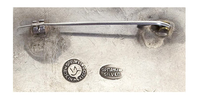 Back of silver "Petate Brooch" #1055886 by William Spratling showing metal stamps.