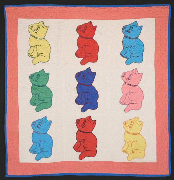 Antique pink and white Cats Crib Quilt with embroidered cats in yellow, red, blue and pink and green fabric.