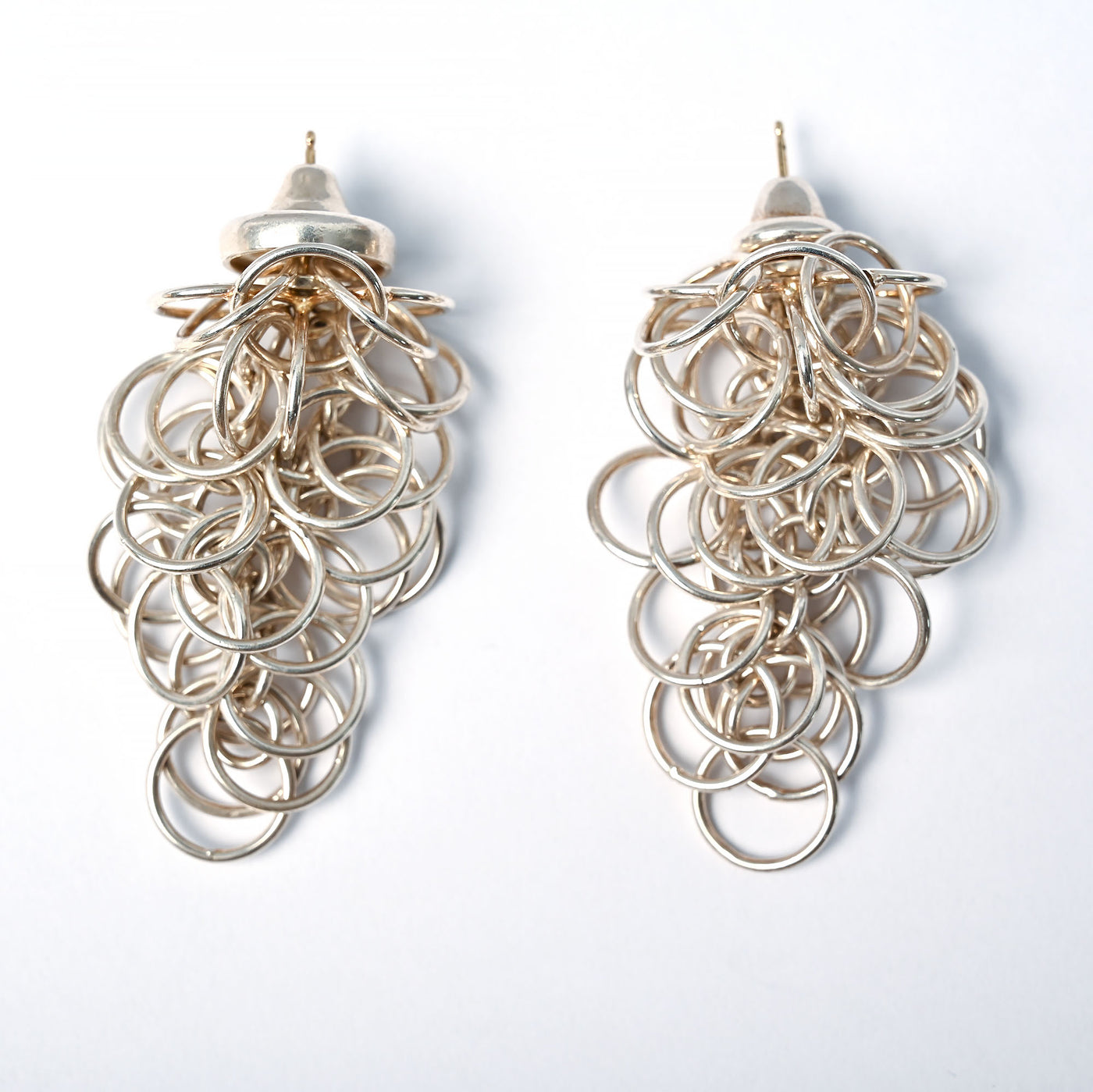 Tane sterling silver earrings made up of many interwoven circles.