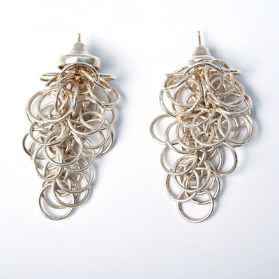 Tane sterling silver earrings made up of many interwoven circles.