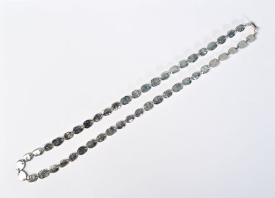 Lay flat top view of Tane Oval Links Silver Necklace with clasp closed.