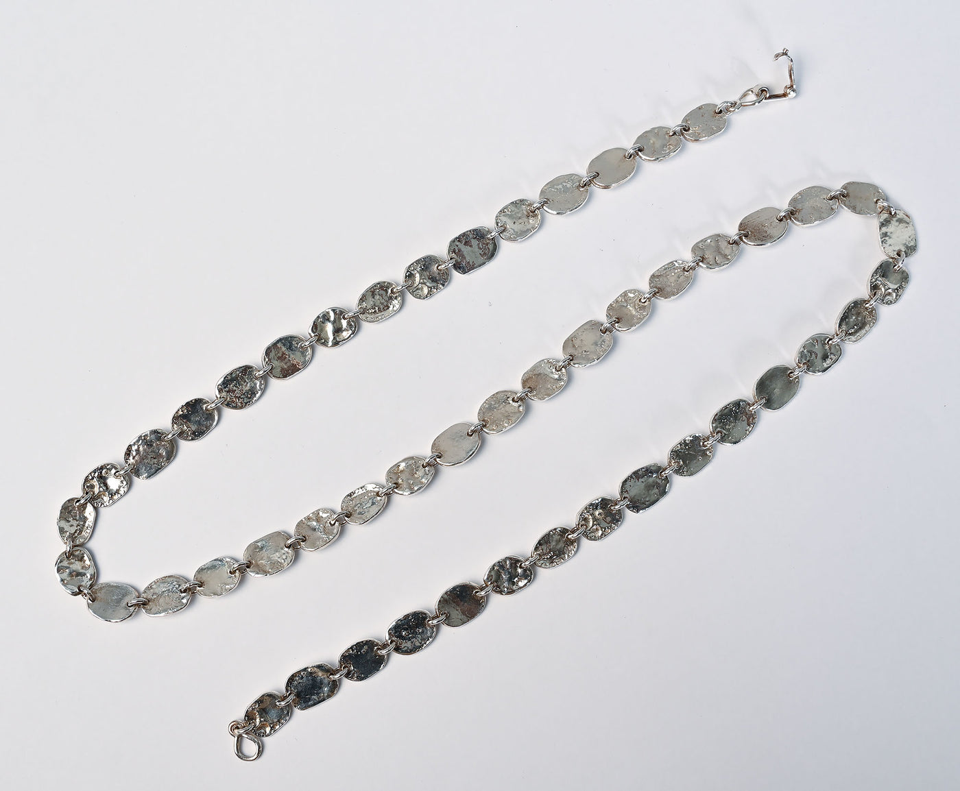 Open clasp top view of Tane Oval Links Silver Necklace.
