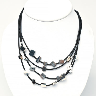 Tane sterling silver and rubber multi strand necklace.