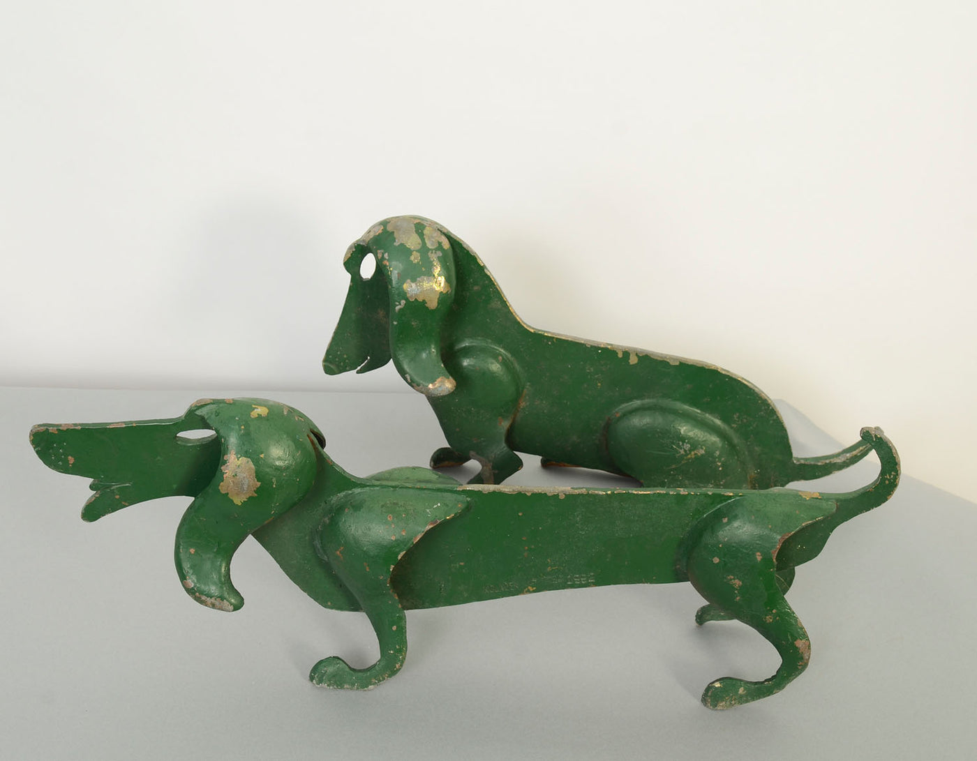 1415273-pair-of-green-dachshund-bootscrapers-side-view