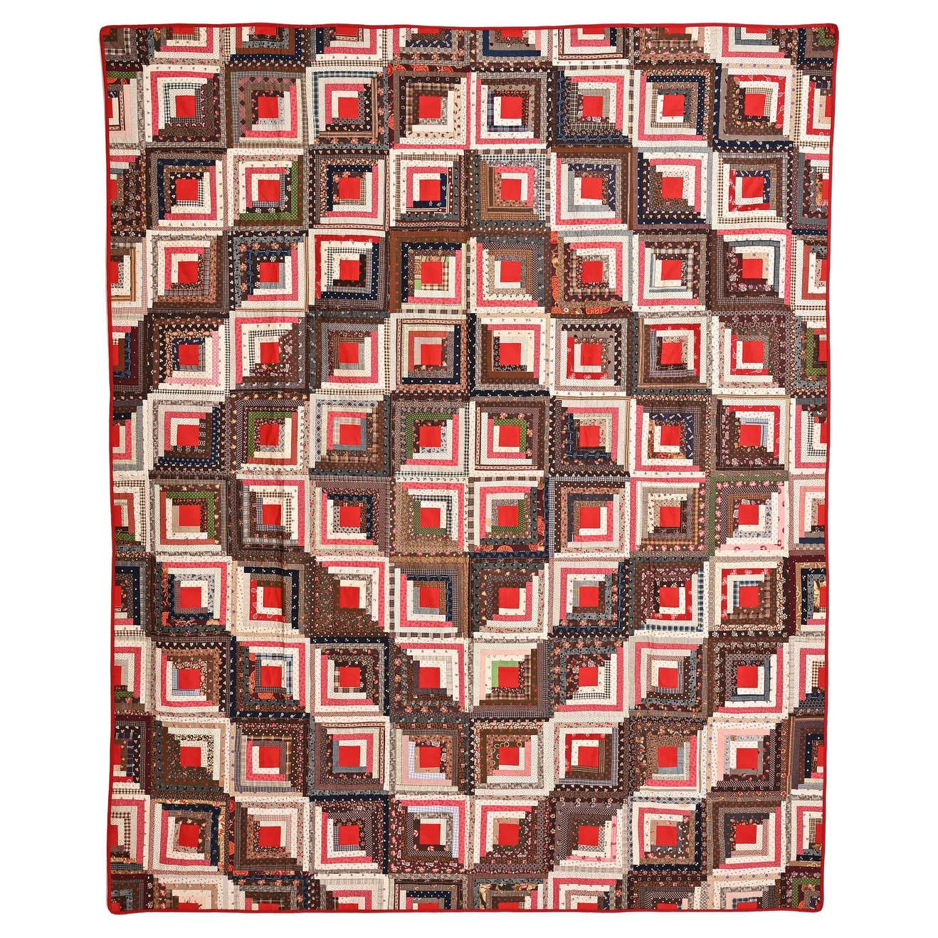 19th century Barn-raising Log Cabin Quilt with solid red centers next to printed multicolored fabrics.