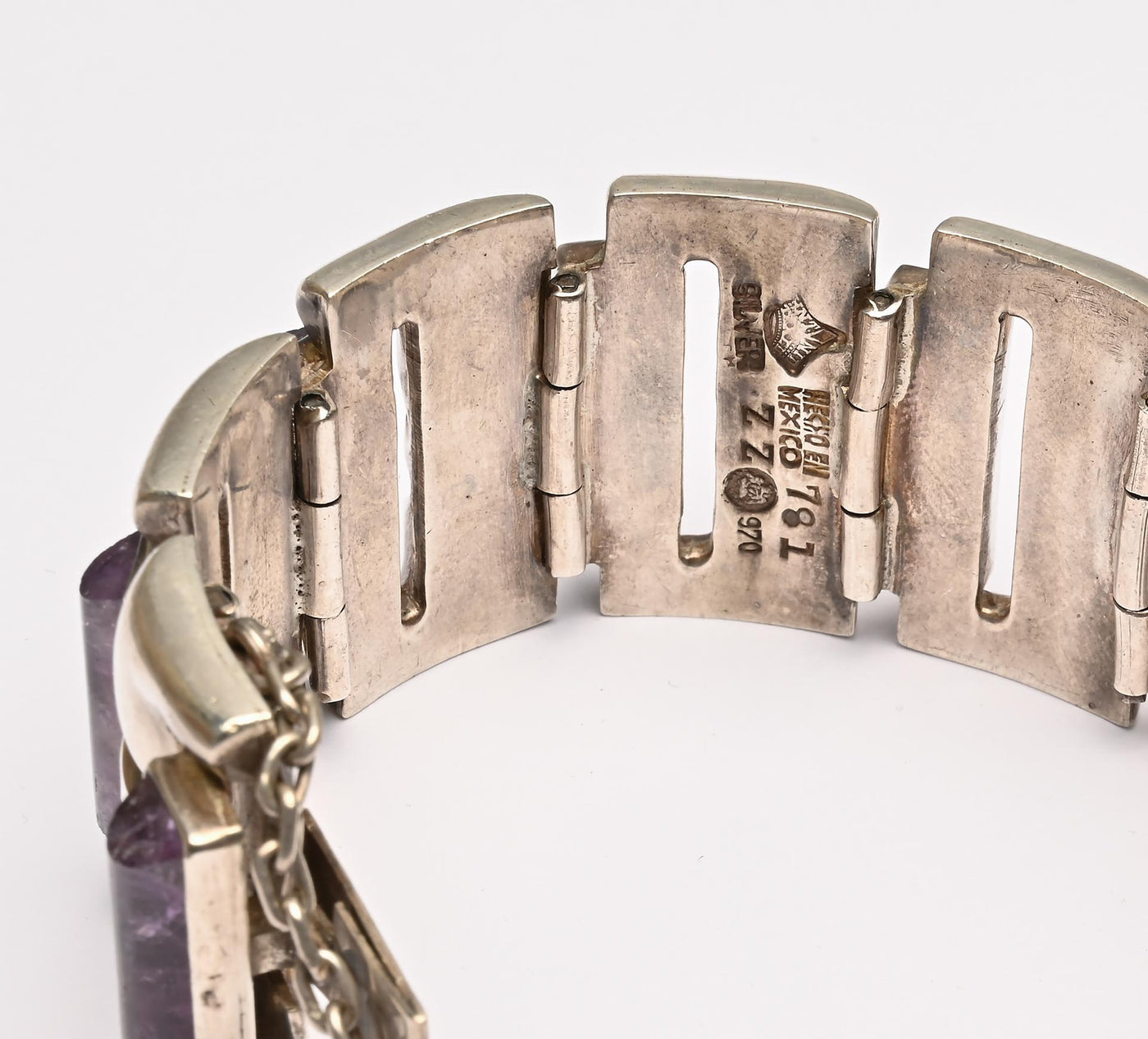 Silver bracelet showing stamps reading "Mexico," "SS 970," and "781"