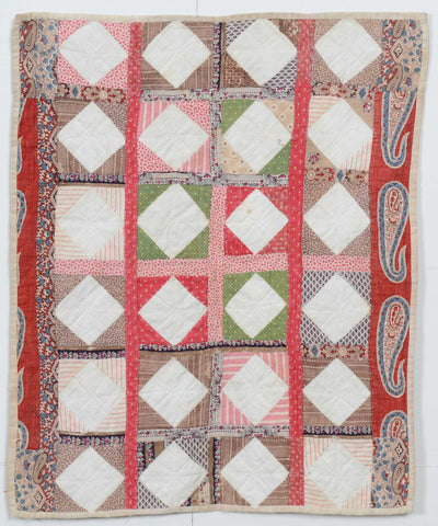 Economy Patch Doll Quilt Circa 1870 from Pennsylvania with white diamonds and paisley borders.