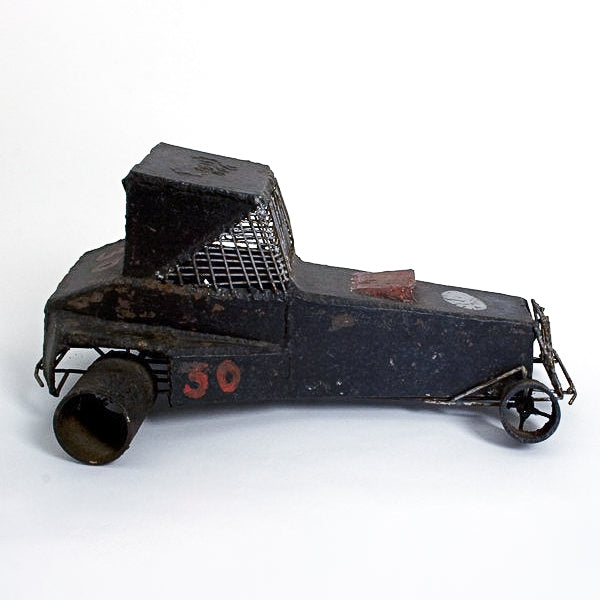 Antique 20th century homemade iron racing toy car with #30 on the side.