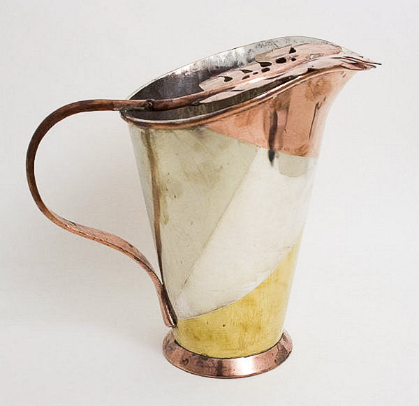 Silver, copper and brass married metals pitcher by artist Los Castillo. 