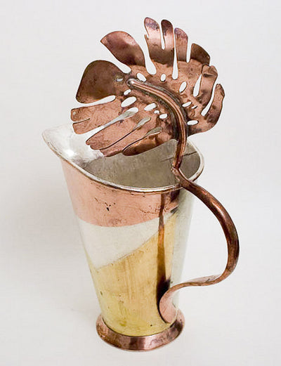 Los Castillo married metals pitcher with copper leaf lid.