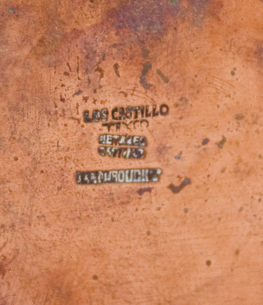 Metal stamp reading "Los Castillo, Taxco". 
