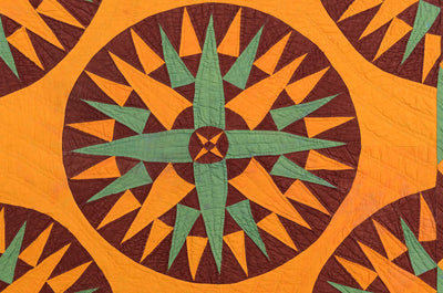 Close up of compass on Mariner's Compass Crib Quilt.