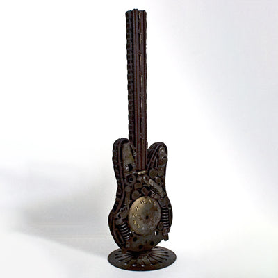 Side view of antique metal guitar made from assembled parts item #986376 sold by Stella Rubin Antiques.