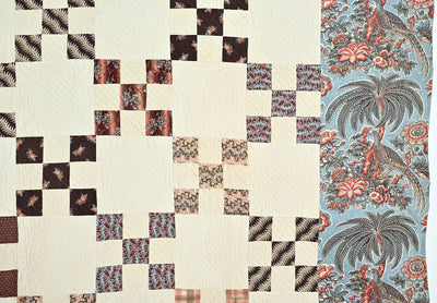 Antique Chintz Nine Patch quilt #1023 showing palm trees and peacocks along the border.
