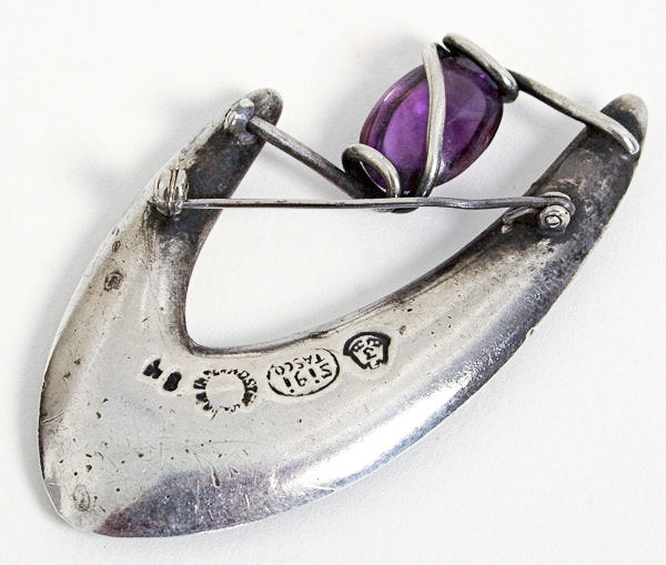Backside of silver and amethyst brooch by Sigi Pineda showing metal stamps.