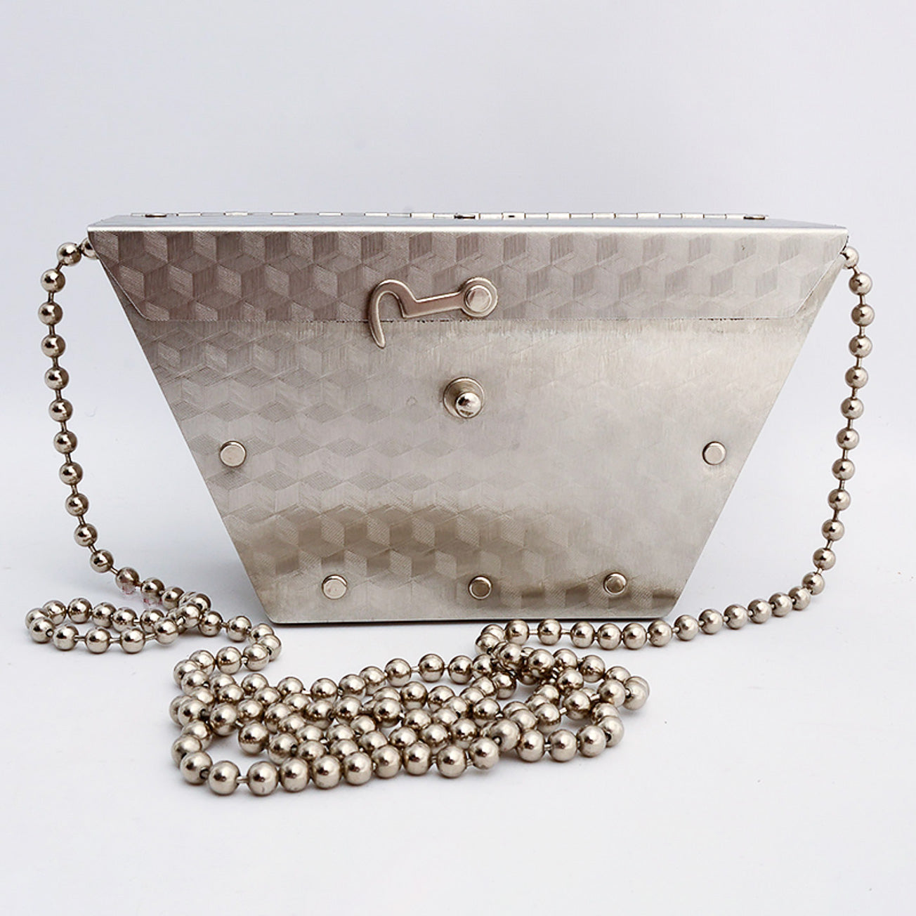 Stainless steel purse by Wendy Stevens with a strap made of steel balls and a hook latch.