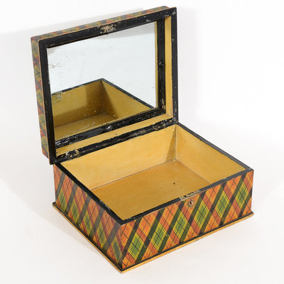 Antique orange, green, red and yellow plaid box from the 19th century opened, showing the inside and mirror. 