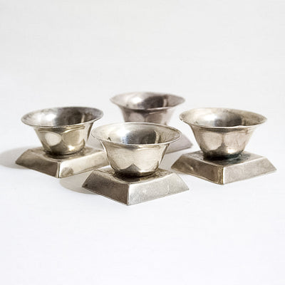 Four antique sterling silver salts by William Spratling, sold by Stella Rubin Antiques.